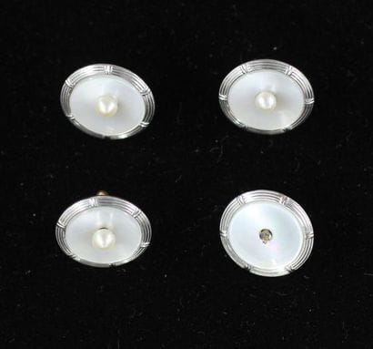 Four buttons in 18k yellow and white gold,...
