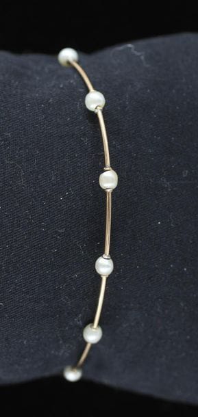 Rigid bracelet in 18k yellow gold and pearls,...
