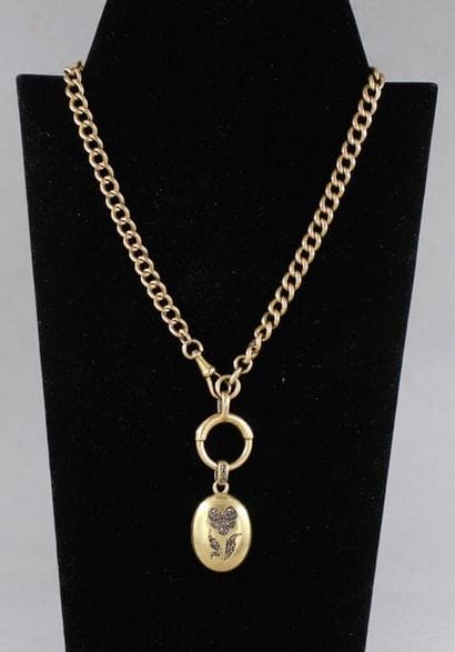 Chaine de montre en or jaune 18k orné d'un...