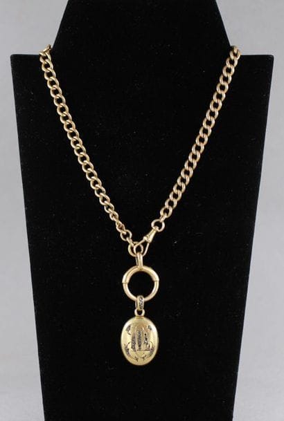 Chaine de montre en or jaune 18k orné d'un...