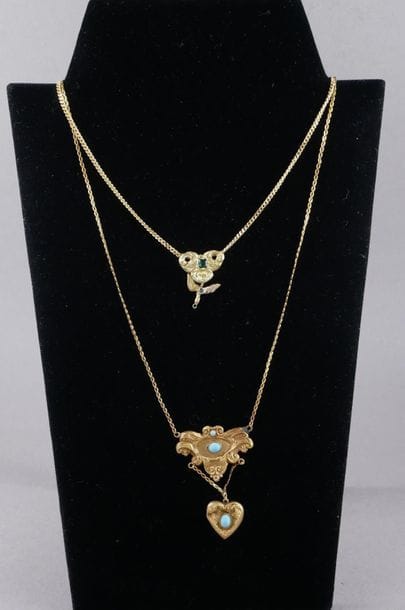 *Two 18k yellow gold necklaces with pendants...