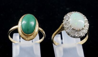 *Two oval rings in 18k yellow gold set with...