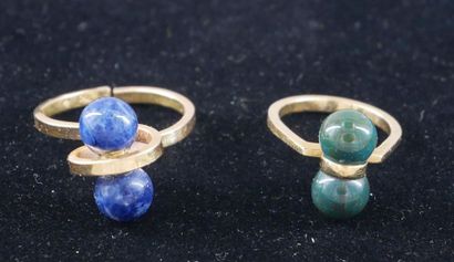 *Two 18k yellow gold rings set with hard...