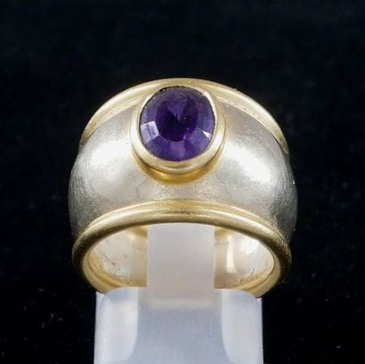*18k yellow gold dome ring set with an oval...