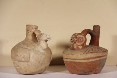 Set of two vases :

Stirrup vase in the shape...