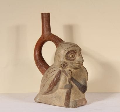 Stirrup vase representing a man with a bird's...