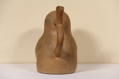 Stirrup vase representing a character wearing...