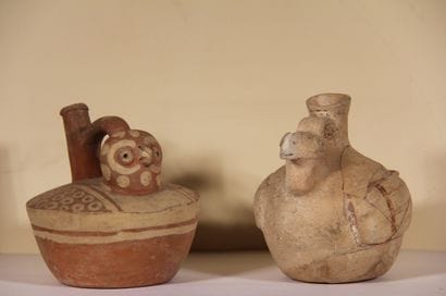 Set of two vases :

Stirrup vase in the shape...
