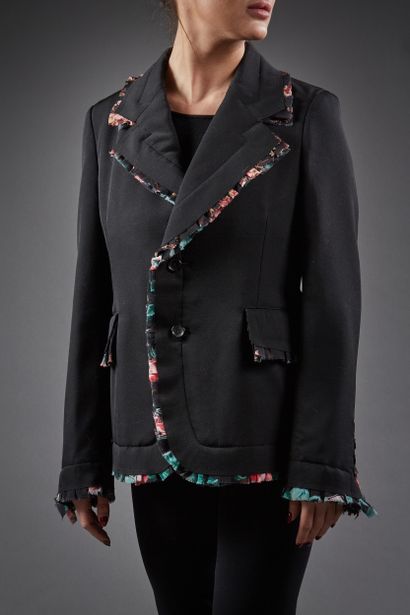Comme des Garçons

Veste en lainage noir,...