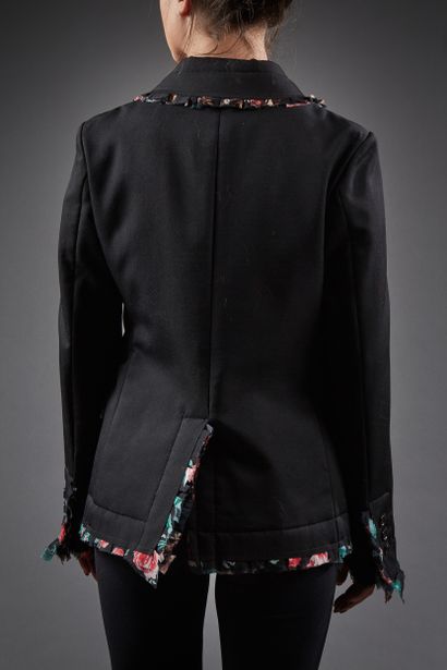 Comme des Garçons

Veste en lainage noir,...