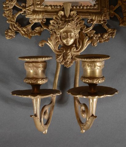 Pair of brass and bronze mirrors with two...