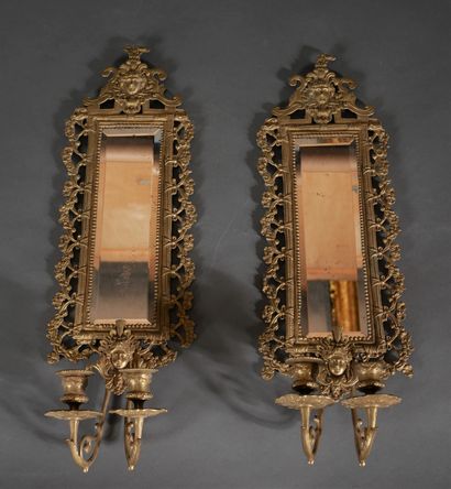 Pair of brass and bronze mirrors with two...