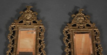 Pair of brass and bronze mirrors with two...