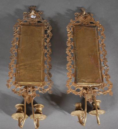 Pair of brass and bronze mirrors with two...