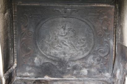 Cast iron fireback decorated with characters...