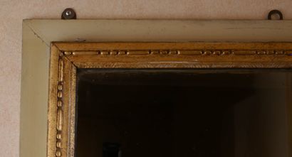 Rectangular glass in carved wood, stuccoed,...