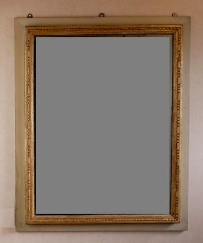 Rectangular glass in carved wood, stuccoed,...