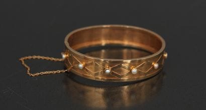 Bracelet rigide articulé en or jaune 18k...
