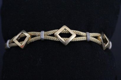 Bracelet deux brins en or jaune tressé orné...