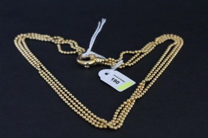Collier trois rangs de petites boules d'or...
