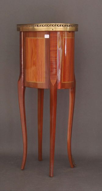 Oval veneered coffee table opening to three...