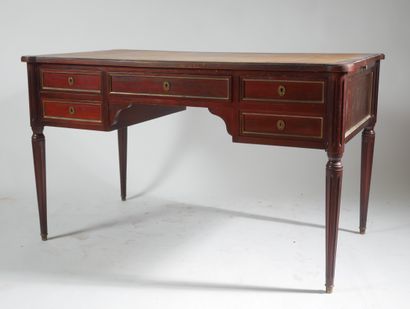 Flat mahogany desk opening with four drawers...