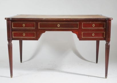 Flat mahogany desk opening with four drawers...