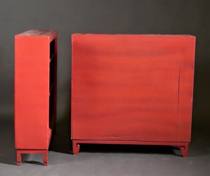 Pair of red lacquered wood bookcases on scalloped,...