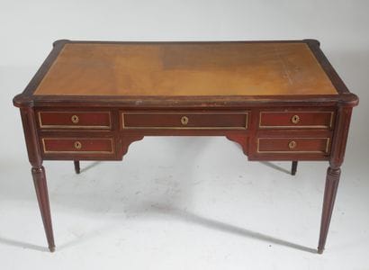 Flat mahogany desk opening with four drawers...