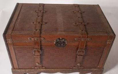 Small travel trunk in wood sheathed in imitation...