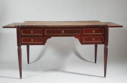Flat mahogany desk opening with four drawers...