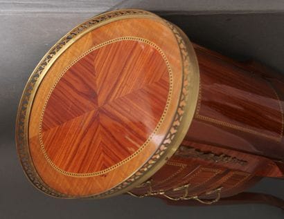 Oval veneered coffee table opening to three...