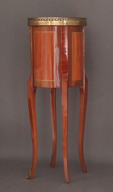 Oval veneered coffee table opening to three...