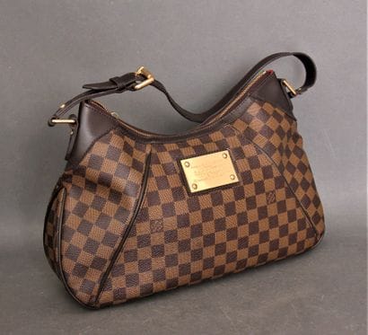 *LOUIS VUITTON
Sac à main zippé en toile...