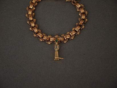 Bracelet en or jaune 18k orné d’une breloque...