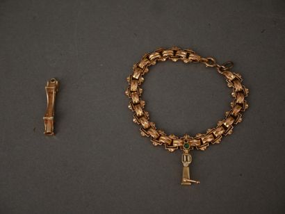 Bracelet en or jaune 18k orné d’une breloque...
