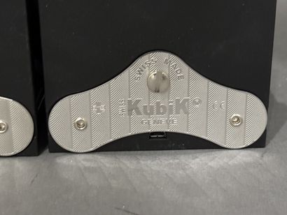 SWISS KUBIK, Genève. 
Quatre remontoirs à...