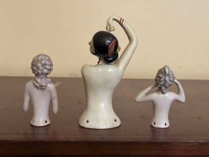 Three polychrome porcelain busts of women...