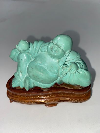 CHINA Set of three turquoise statuettes representing...