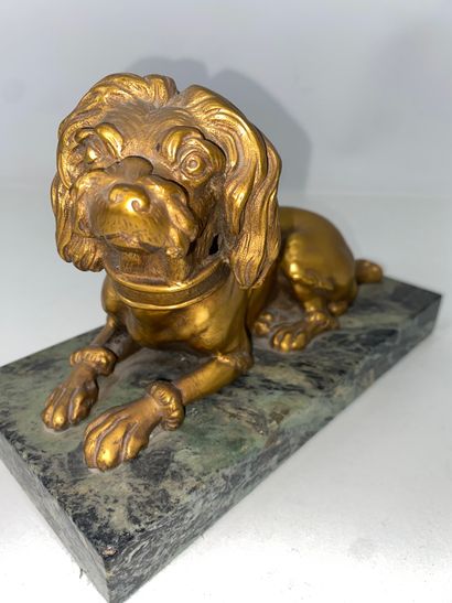 Gilded bronze paperweight of a dog lying...
