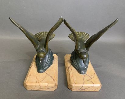 Pair of bookends in patinated metal on a...