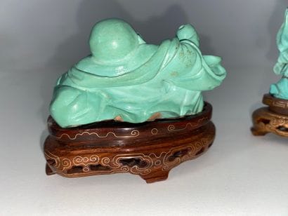 CHINA Set of three turquoise statuettes representing...