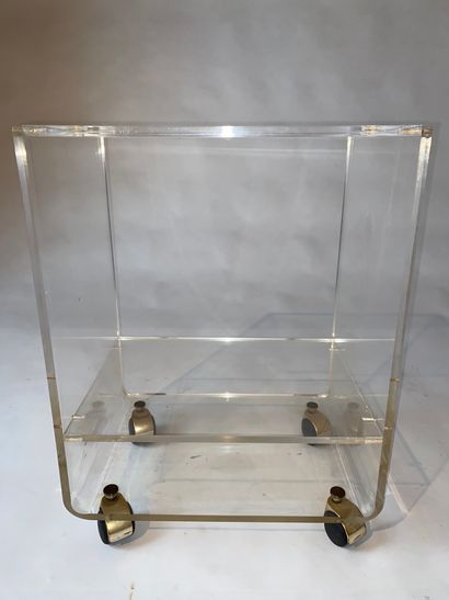 Plexiglass television table, mounted on castors....