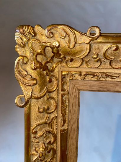 Carved and gilded wood frame, Louis XV style....