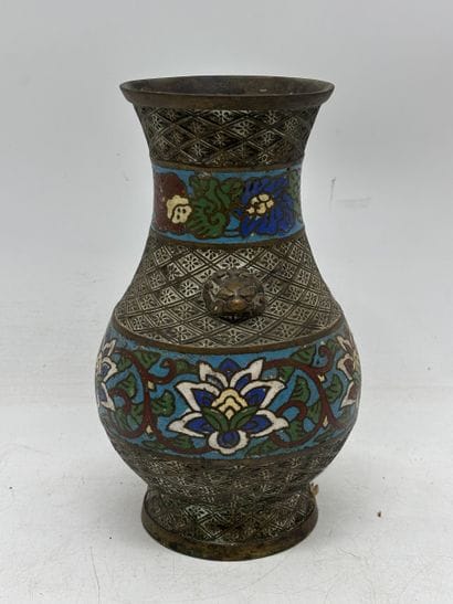 Patinated bronze baluster vase with two lion...