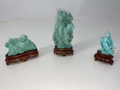 CHINA Set of three turquoise statuettes representing...