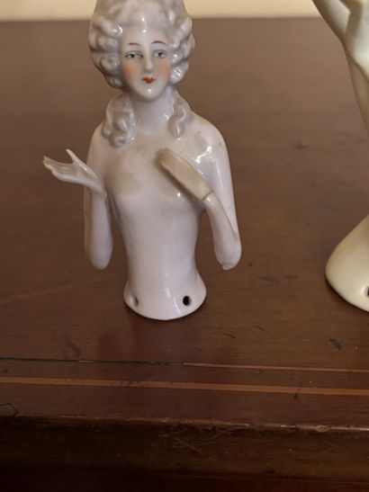 Three polychrome porcelain busts of women...