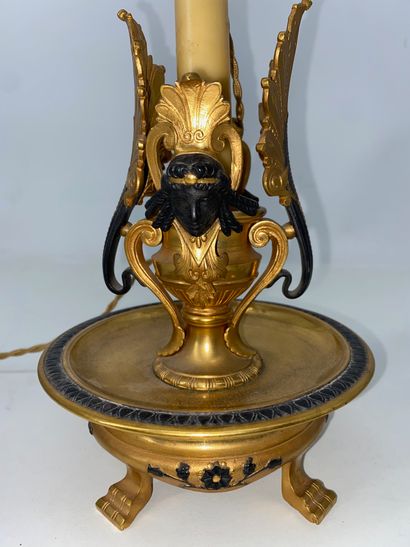 Gilt bronze and brown patina bronze candlestick,...