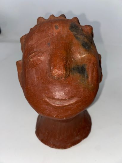Funerary mask in partially yellow enameled...