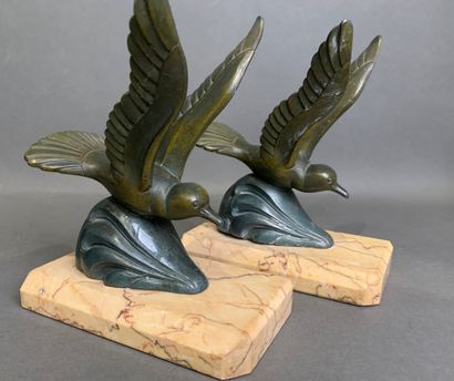 Pair of bookends in patinated metal on a...